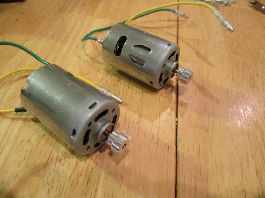 Pinions attached to the motors